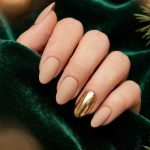 Shine Bright This Holiday Season: A Guide to Gold Christmas Nails