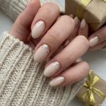 Shine Bright This Holiday Season: A Guide to Gold Christmas Nails